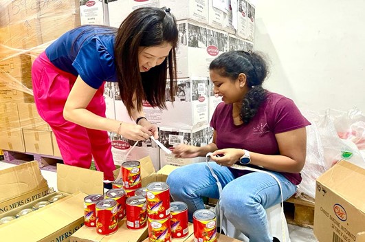 Picture of our staff volunteering at Food from the Heart.